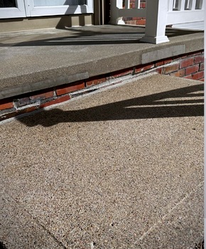 Patched stoop, caulked brick, washed and sealed concrete